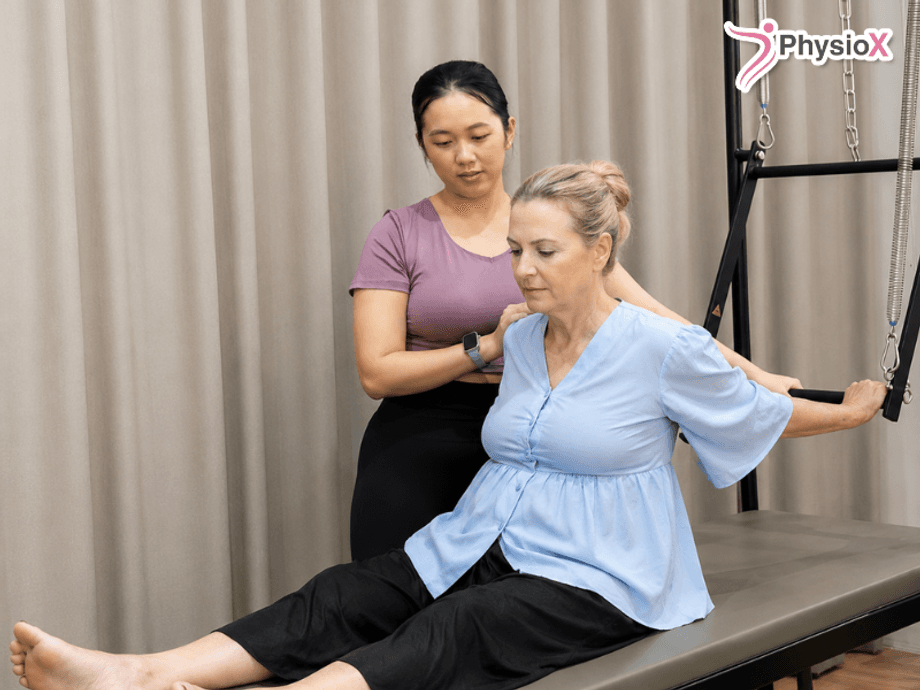 Physiotherapist providing guided rehabilitation exercises for a stroke rehabilitation programme